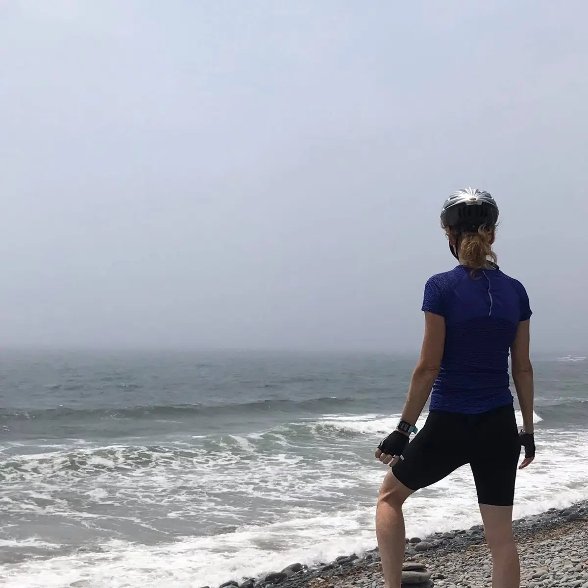 Ginger Canning looking out over the Atlantic at Lawrencetown Beach on a foggy morning
